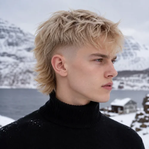 Young Scandinavian man with platinum-blond modern mullet fade wearing a black turtleneck in a snowy mountain landscape.